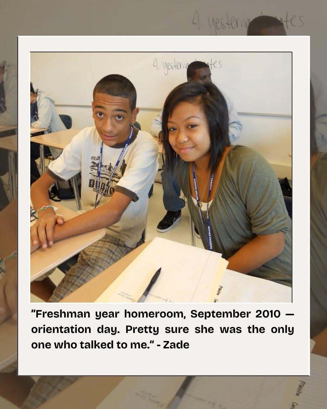 Maleiha at her desk in freshman homeroom, turned toward the camera beside a classmate.